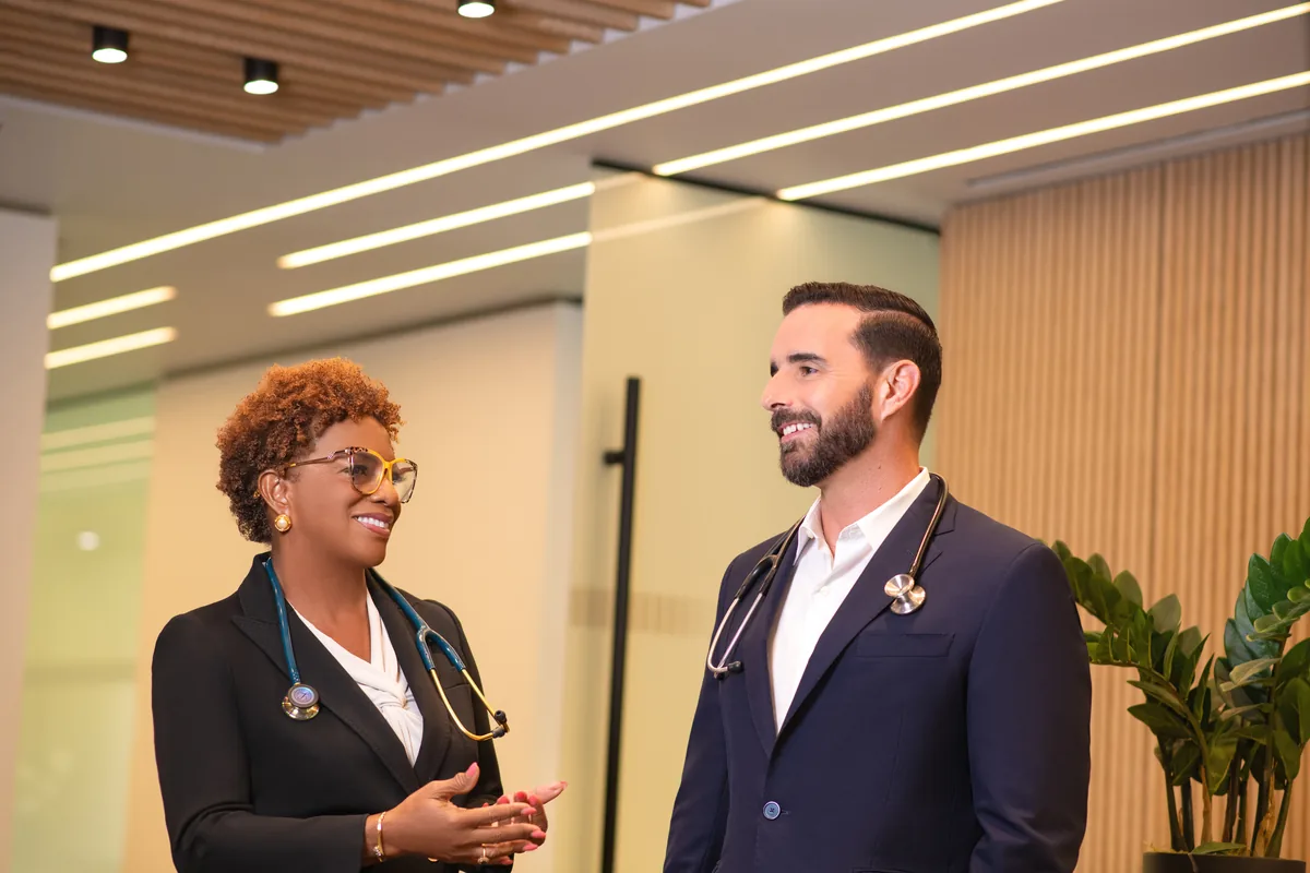 Two Naples Concierge Health physicians talking in the practice's office.