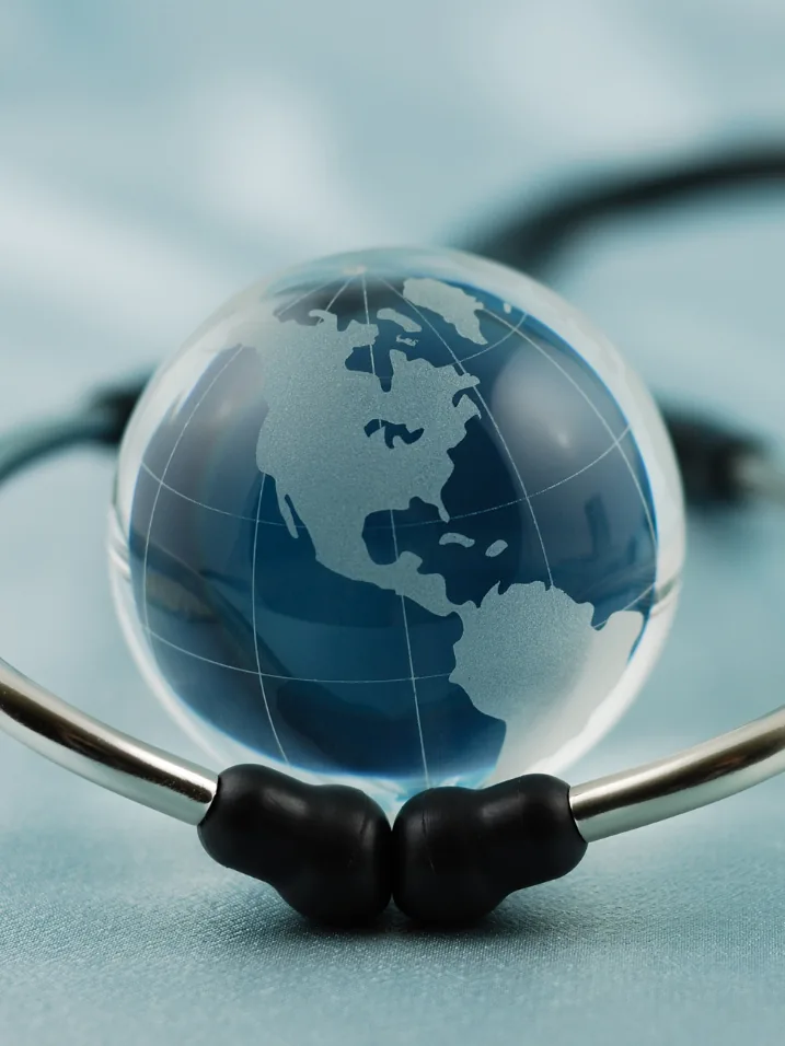 A globe beside a stethoscope