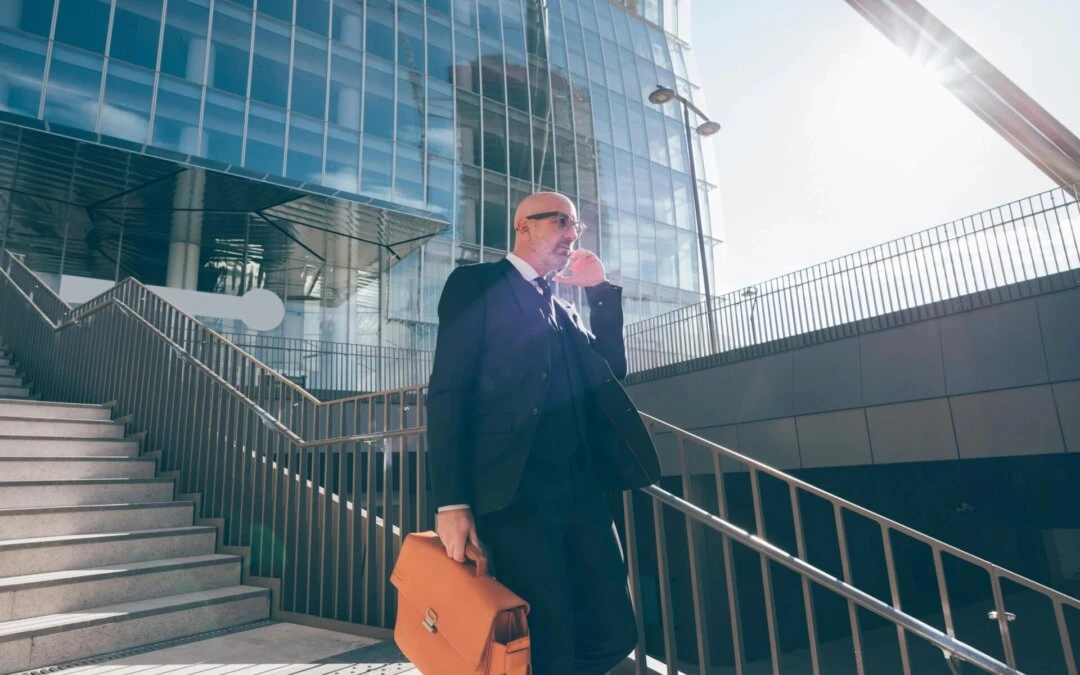 Active adult over 50 using smartphone to communicate with concierge physician while traveling